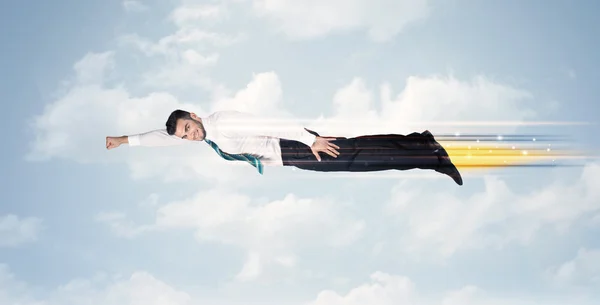 Happy business man flying fast on the sky between clouds — Stock Photo, Image