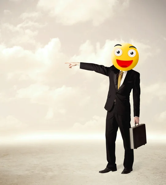 Businessman wears yellow smiley face — Stock Photo, Image