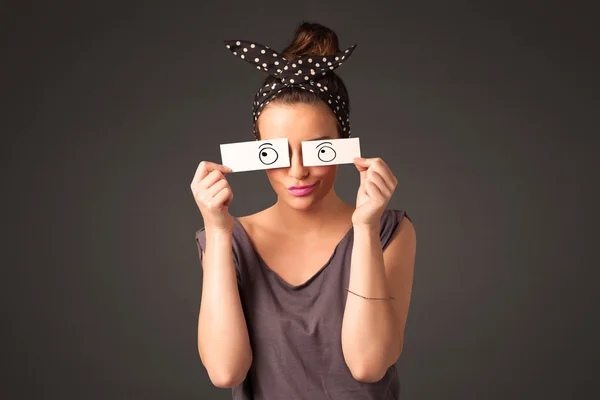 Young silly girl looking with hand drawn eye balls on paper — Stock Photo, Image