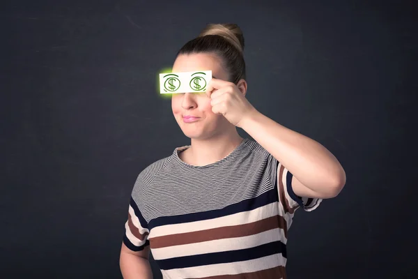 Joven sosteniendo papel con signo de dólar verde — Foto de Stock