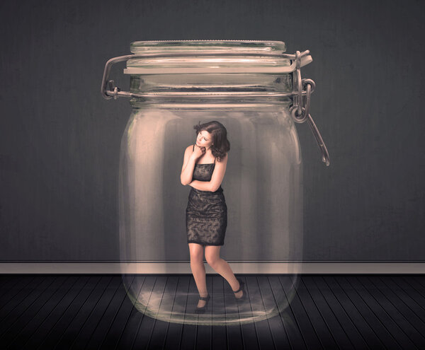 Businesswoman trapped into a glass jar concept