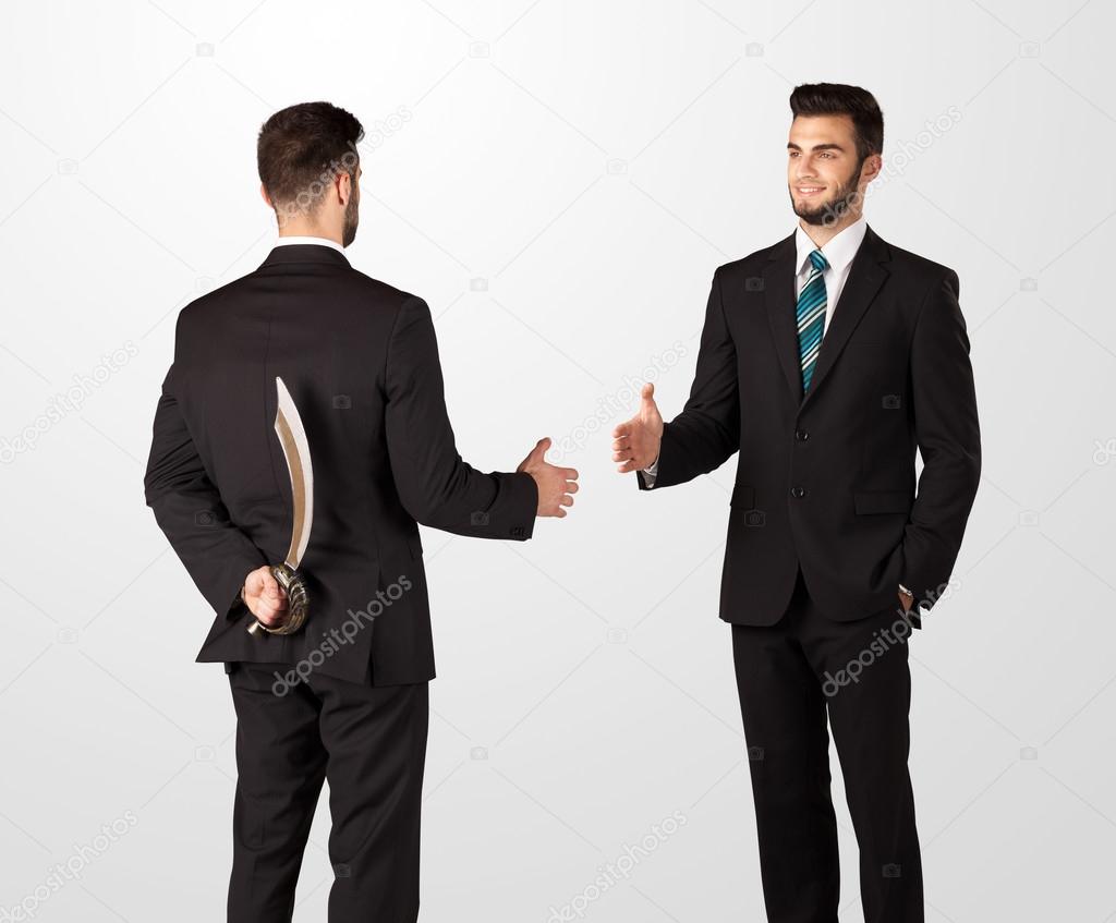 Two businessman shake hands