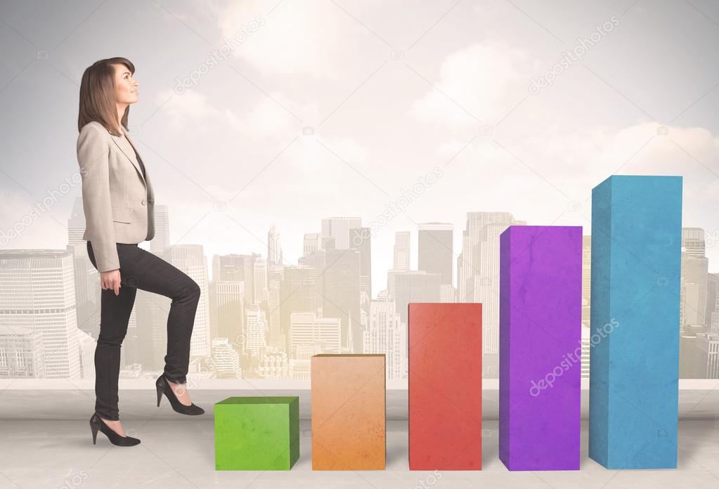 Business person climbing up on colourful chart pillars concept