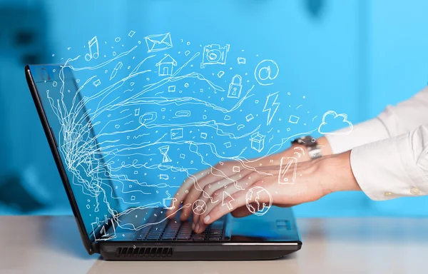 Man pressing notebook laptop computer with doodle icon cloud sym — Stock Photo, Image