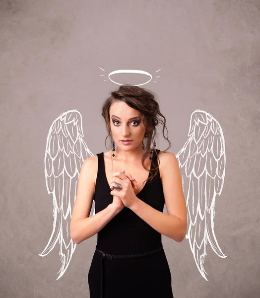 Cute girl with angel illustrated wings — Stock Photo, Image