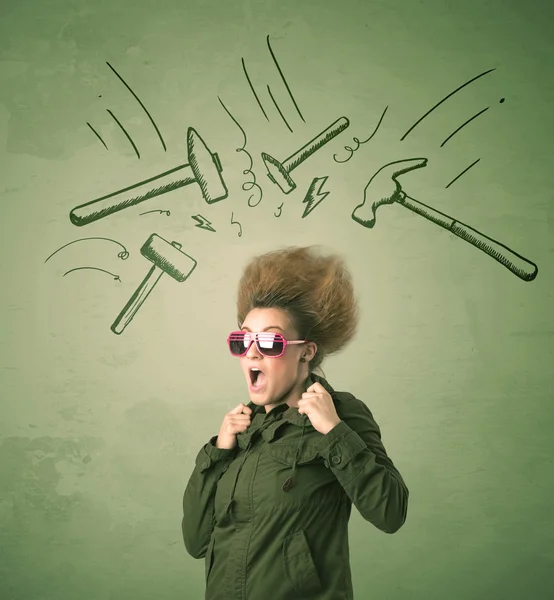 Tired woman with hair style and headache hammer symbols — Stock Photo, Image