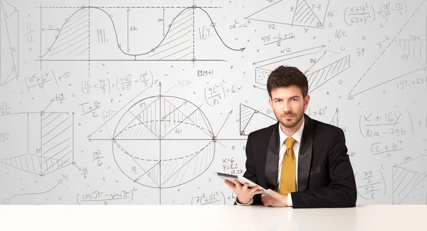 Businessman with business calculations background — Stock Photo, Image