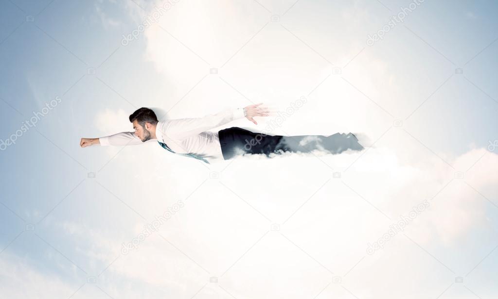 Business man flying like a superhero in clouds on the sky