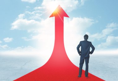 üzerinde kırmızı bir ok ayakta işadamı