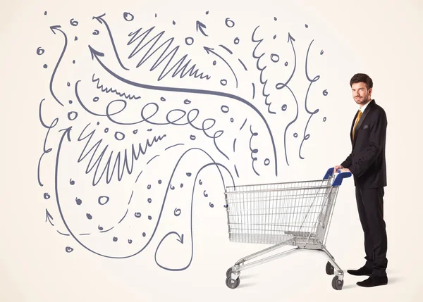 Businessman with shopping cart — Stock Photo, Image