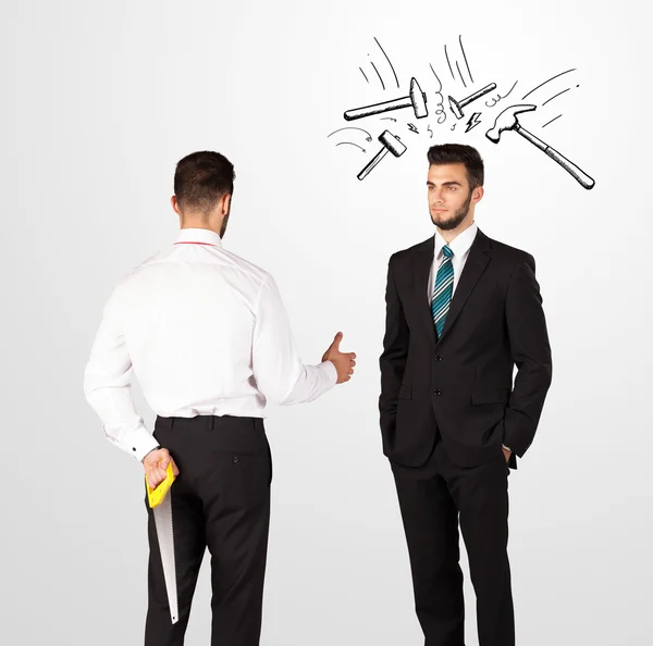 Businessman hiding a weapon — Stock Photo, Image