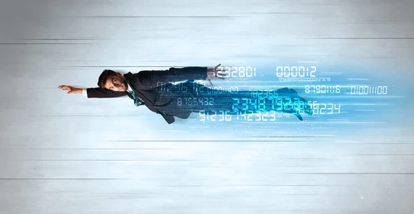 Businessman flying super fast with data numbers left behind — Stock Photo, Image