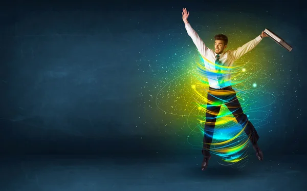 Emocionado hombre de negocios saltando con líneas de colores de energía —  Fotos de Stock