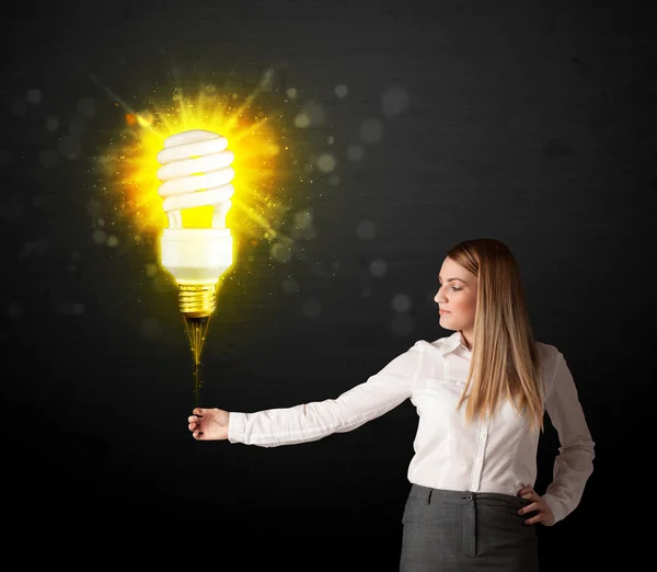 Businesswoman with an eco-friendly  bulb — Stock Photo, Image