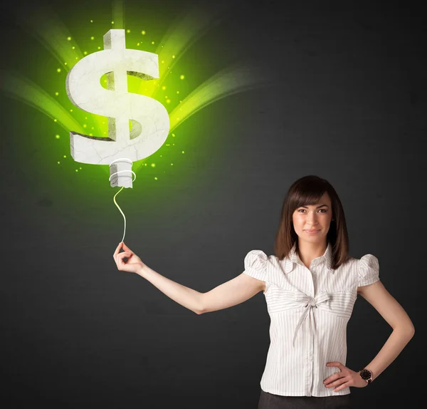 Mujer de negocios con un globo signo de dólar — Foto de Stock