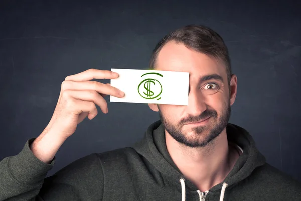 Guy holding a paper with hand drawn dollar sign — Stock Photo, Image
