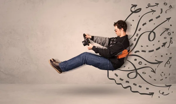 Funny man driving a flying vehicle with hand drawn lines after h — Stock Photo, Image