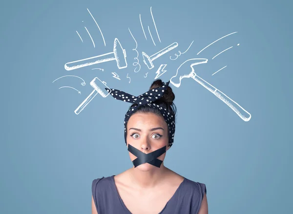 Young woman with glued mouth and hammer marks — Stock Photo, Image