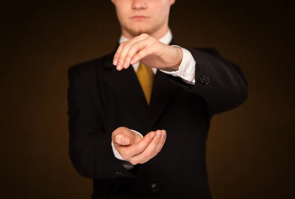 Businessman holding something — Stock Photo, Image