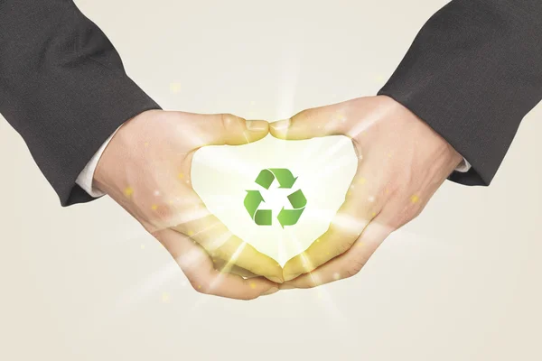 Hands creating a form with recycling sign — Stock Photo, Image