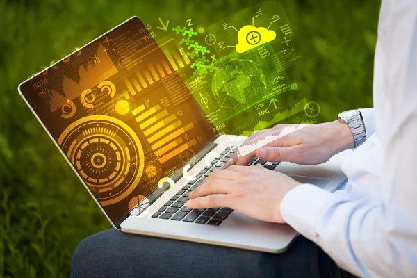 Modern notebook computer with future technology symbols — Stock Photo, Image