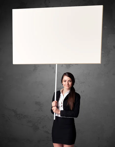 Businesswoman with blank whiteboard — Stock Photo, Image