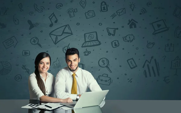 Business couple with media icons background — Stock Photo, Image