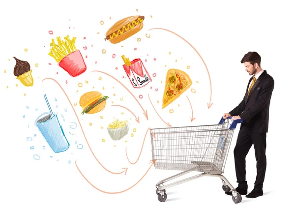 Man with shopping cart with toxic junk food — Stock Photo, Image