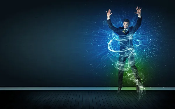 Talentoso hombre de negocios alegre saltando con líneas de energía brillantes — Foto de Stock