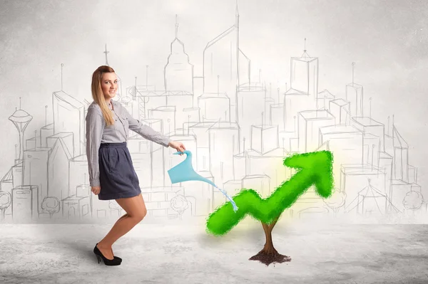 Business woman watering green plant arrow — Stock Photo, Image