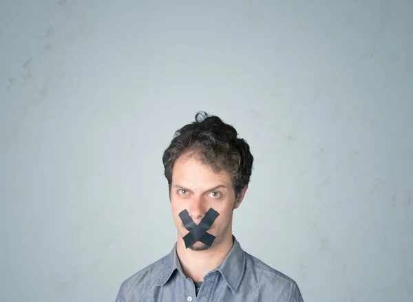 Young man with glued mouth — Stock Photo, Image
