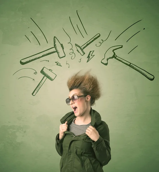 Tired woman with hair style and headache hammer symbols — Stock Photo, Image