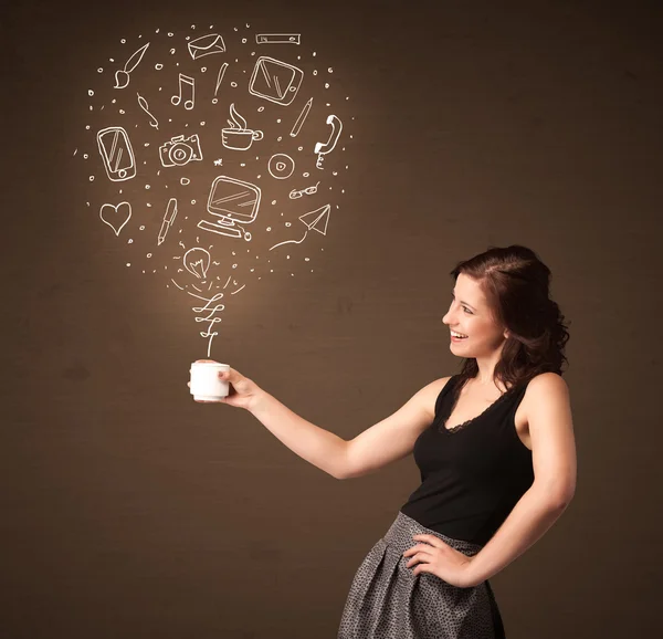 Businesswoman holding a white cup with social media icons — Stock Photo, Image