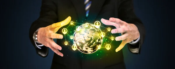 Businessman holding a social media globe — Stock Photo, Image