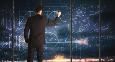 İş adamı iş grafikleri çiziyor