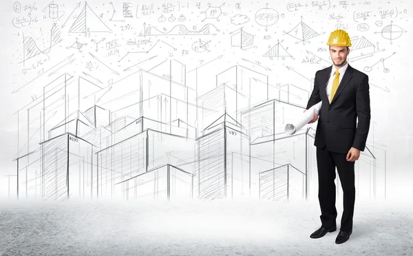 Handsome construction specialist with city drawing in background — Stock Photo, Image