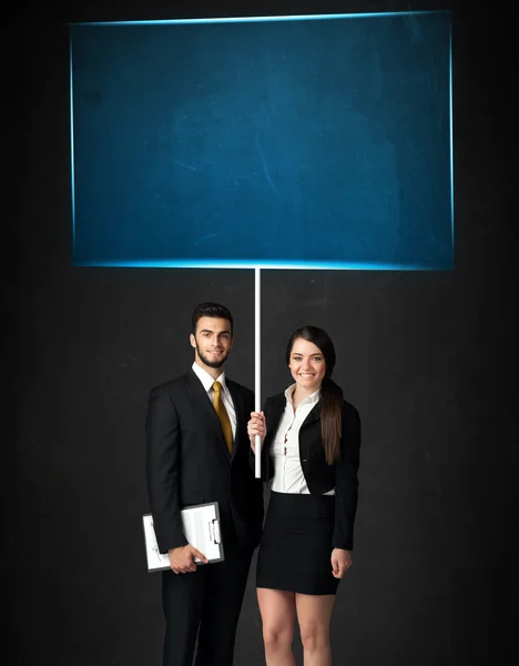 Business couple with blue board — Stock Photo, Image