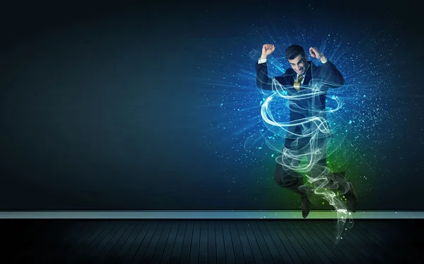 Talented cheerful businessman jumping with glowing energy lines — Stock Photo, Image