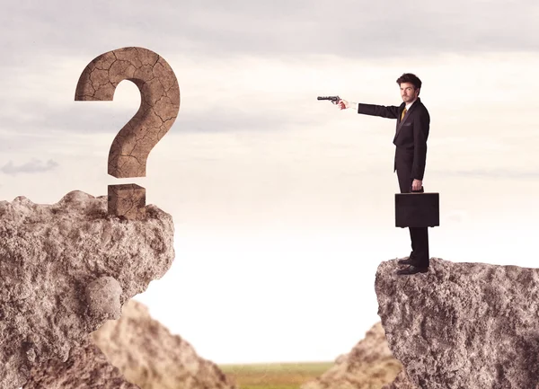 Businessman on rock mountain with a question mark — Stock Photo, Image