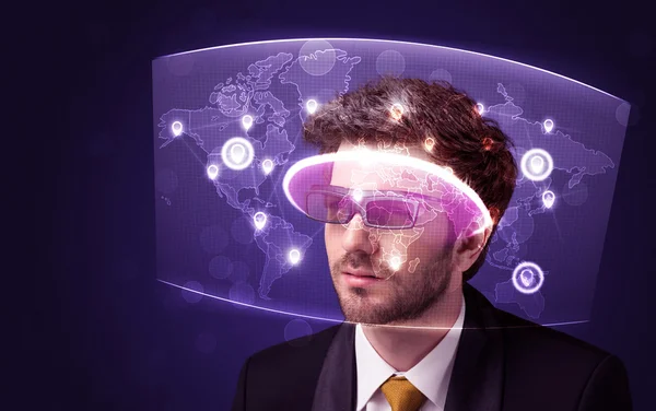 Young man looking at futuristic social network map — Stock Photo, Image