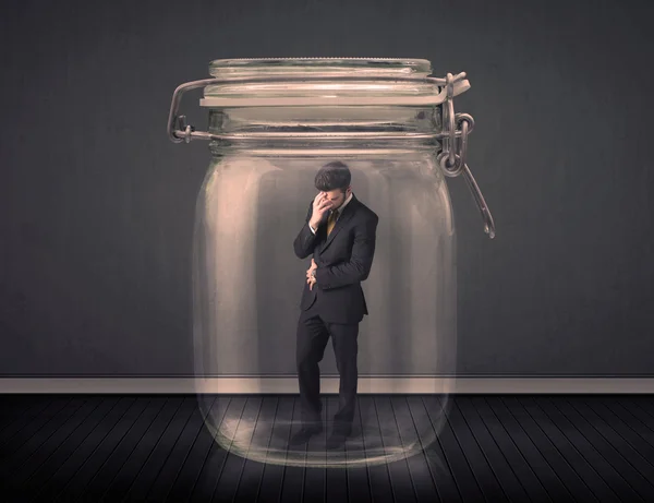 Businessman trapped into a glass jar concept — Stock Photo, Image