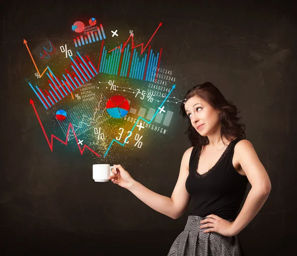 Businesswoman holding a white cup with diagrams and graphs — Stock Photo, Image