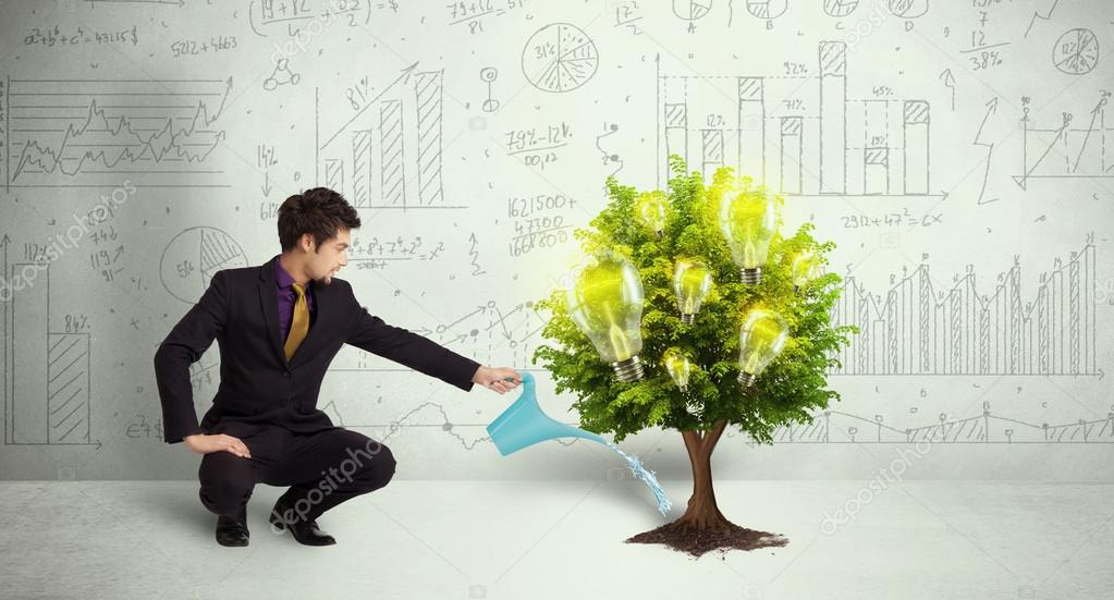 Business man pouring water on lightbulb growing tree