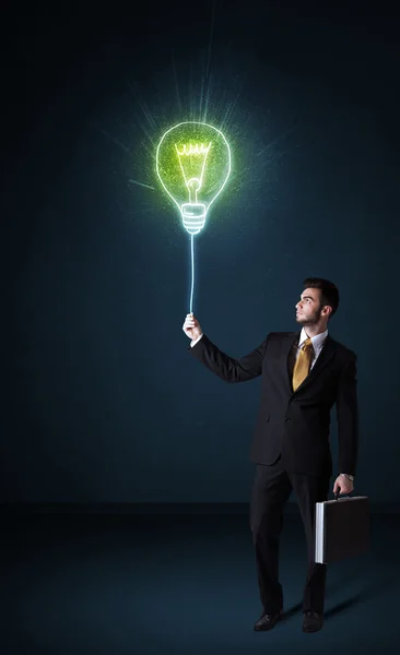 Businessman with an idea bulb — Stock Photo, Image