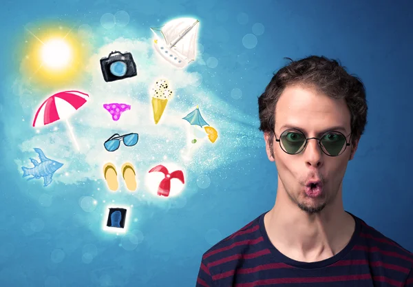 Happy joyful man with sunglasses looking at summer icons — Stok Foto