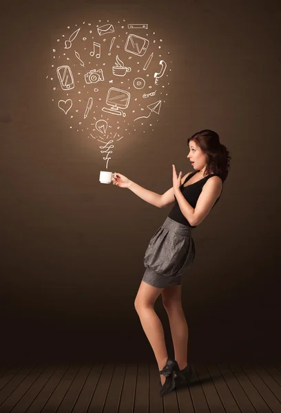 Businesswoman holding a white cup with social media icons — Stock Photo, Image