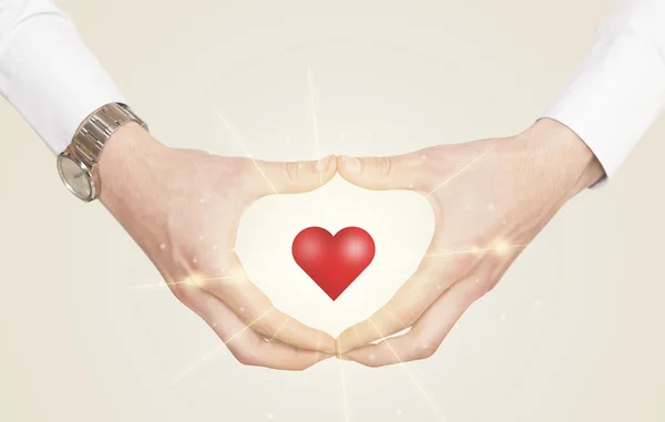 Hands creating a form with shining heart — Stock Photo, Image