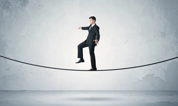 Sales guy balancing on tight rope — Stock Photo, Image