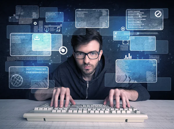 Nerd with glasses hacking websites — Stock Photo, Image