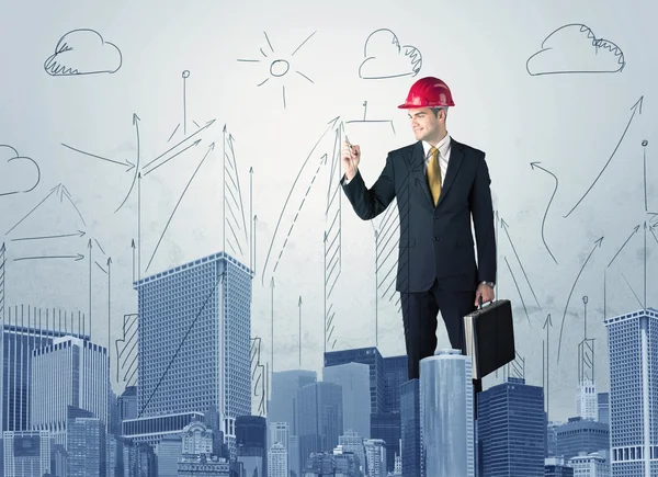 Joven trabajador dibujando una ciudad vista — Foto de Stock